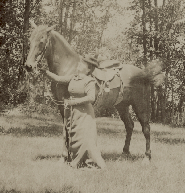 Belle Case La Follette with horse at farm in Maple Bluff, Wisconsin.