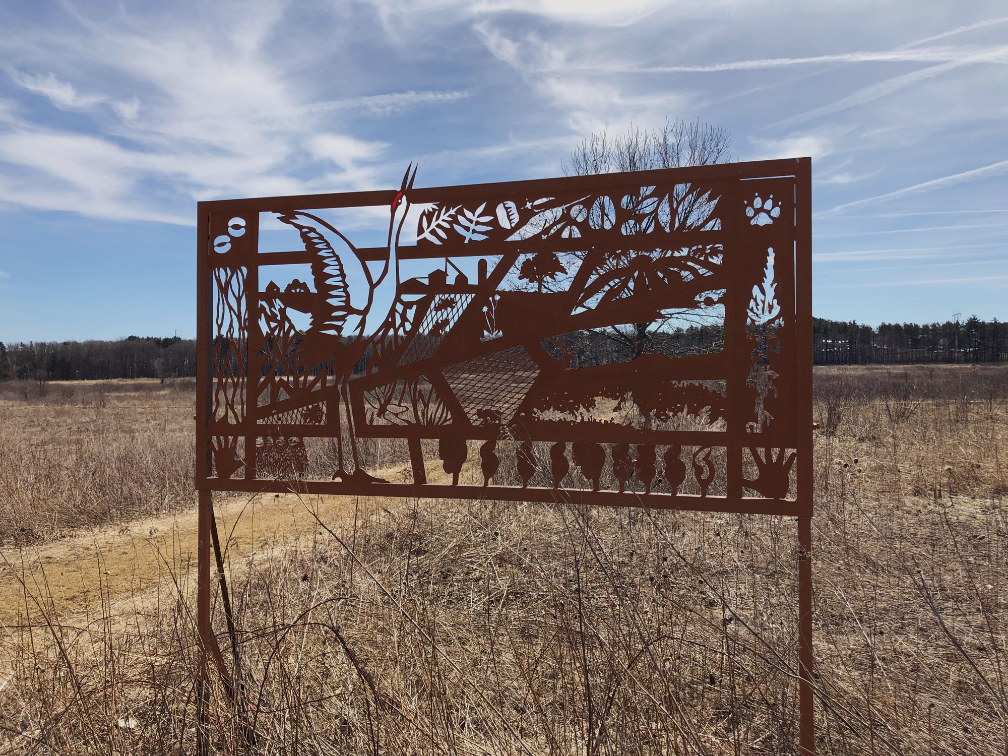 Curtis Prairie metal sign in the University of Wisconsin Arboretum in Madison, Wisconsin on March 26, 2019.