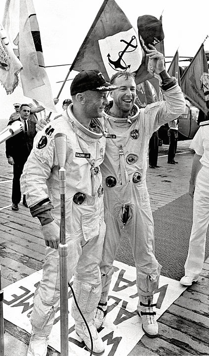 Astronauts James A. Lovell and Edwin E. Aldrin Jr. are welcomed aboard the aircraft carrier U.S.S. Wasp after their Gemini 12 spacecraft splashed down in the Atlantic Ocean on November 15, 1966.
