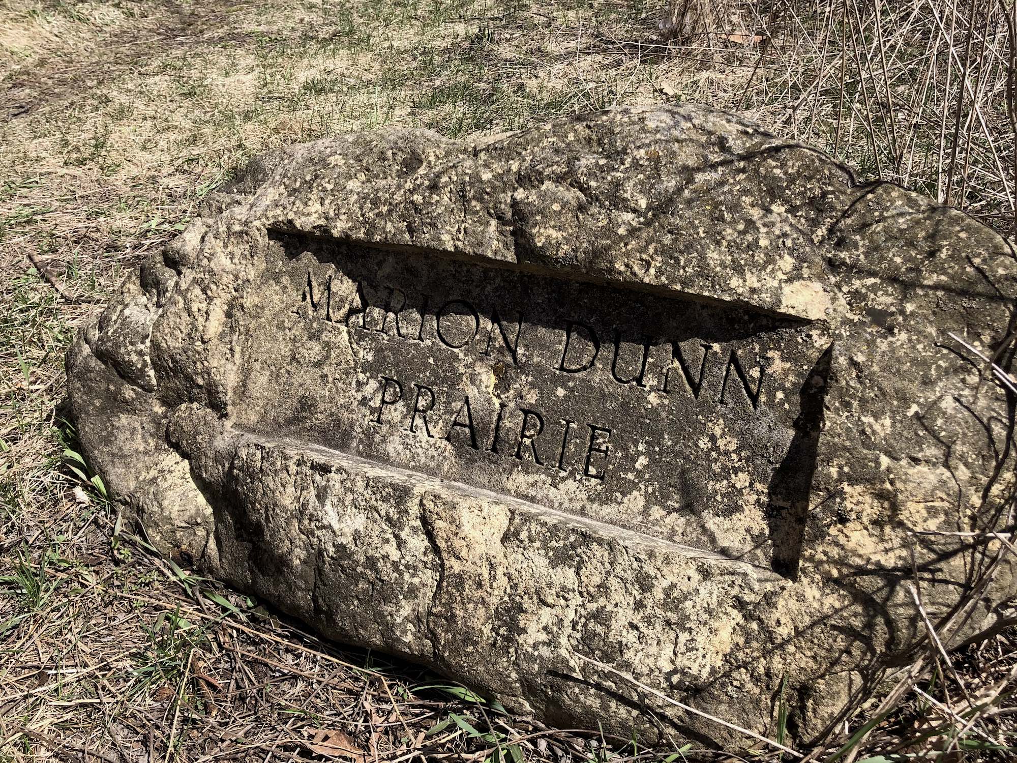 Stone marker to Marion Dunn Prairie.