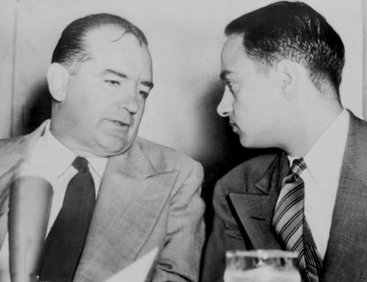 Sen. Joseph McCarthy chats with his attorney Roy Cohn during Senate Subcommittee hearings on the McCarthy-Army dispute in 1954.
