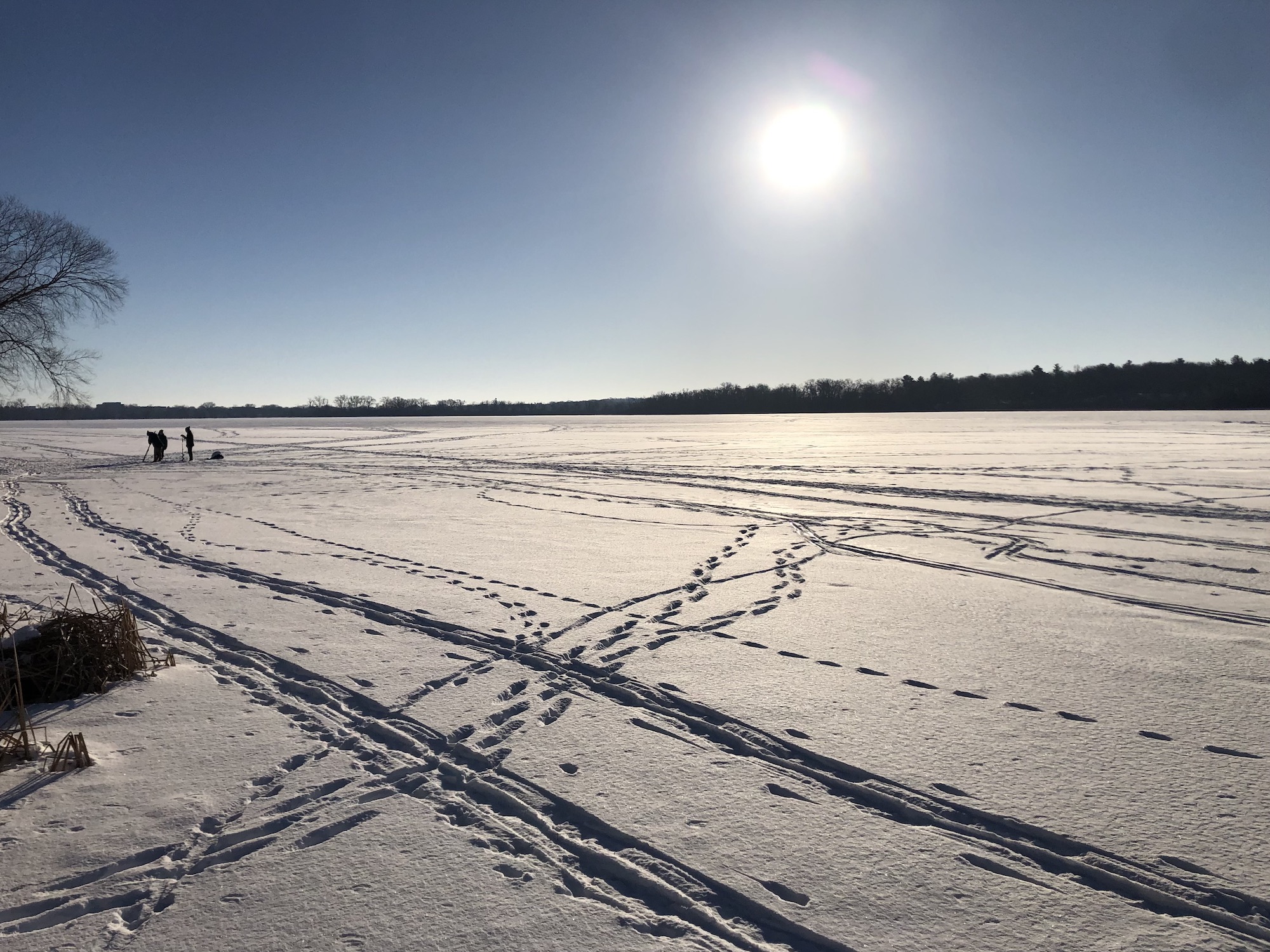 Lake Wingra on February 2, 2023. Groundhog Day.  Jimmy the Groundhog saw his shadow.  6 more weeks of Winter. Lake plungers digging hole in Lake Wingra ice to jump in.